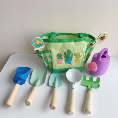 China Preschool Kids Play Set Kit With Metal Tools Shovel Set Kids Fork Rake Wooden Gardening Toys for sale