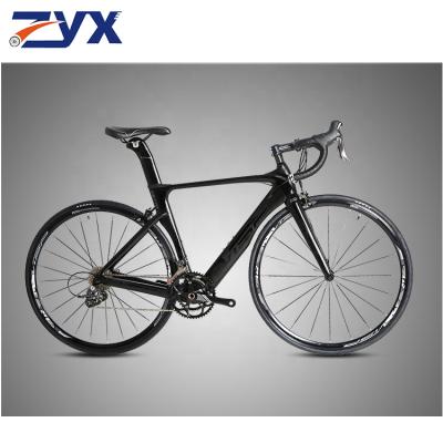 China Carbon fiber specializing in the production of adult 21 speed road racing bicycle 700CC racing venue mountain bike bend road racing for sale