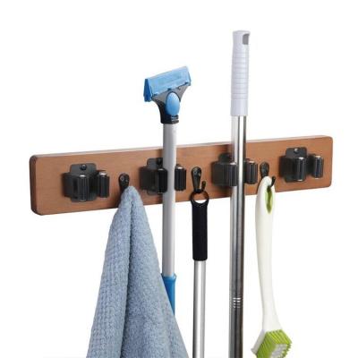 China Wall Hanger Rack Kitchen Garage Tool Organizer Brown Wood Mop Broom Holder Viable Solid Wood Organizer for sale