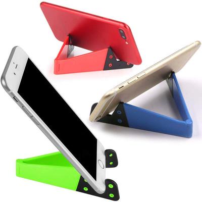 China Wholesale Adjustable Foldable Colorful V-shaped Desktop Lazy Bracket Mobile Phone Display Stand For Mobile Phone Accessories for sale