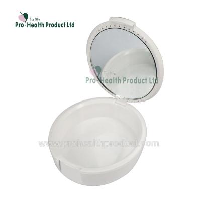 China PE Dental Products Round Retainer Case Portable Orthodontic Dental Box With Mirror for sale