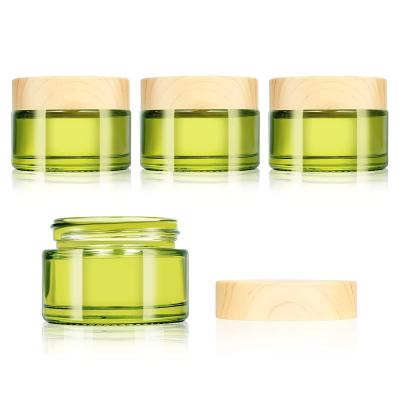 China Refillable 30g Glass Cosmetic Packaging Empty Sample Jars Containers With Bamboo Leakproof Lids for sale