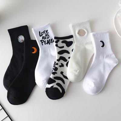 China Hot Sale Antibacterial Autumn Black And White High Quality Tube Socks Breathable Girls Socks for sale