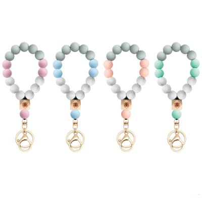 China Silicone Elastic Wood Bead Keychain Bohemia Key Ring Bohemia Elastic Pendant Bracelet Circle Chain Key Chain for sale