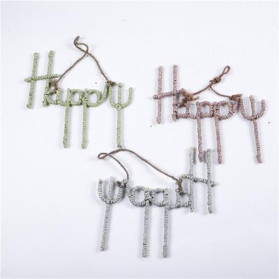 China New Europe Style Nordic Handmade Grass Rope Happy Hanger For Wall Decoration Home Decoration for sale