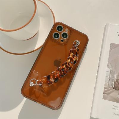 China Design Fashion Clasp Simple Soft Shockproof Brown Amber Bracelet Chain Strap Tpu Mobile Case Cover For iPhone7 xr 8 x plus 11 12 13 pro max for sale