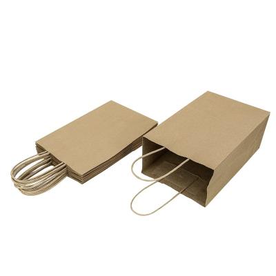 China Recycled Custom Materials New Arrival Festival Paper Bag Printing Design Christmas Paper Bag With Twisted Paper Handles for sale