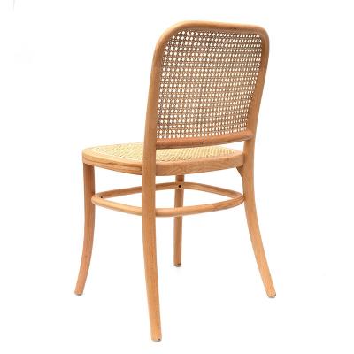 China Vintage Rattan Convertible Light Luxury Single Rattan Dining Chair Comfortable Artist Design Retro Tea Room Chair With Coffee for sale