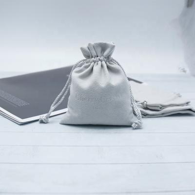 China Gray Embossed Logo Pouch Jewelry Drawstring Suede Pouch Packaging by Suede Soft Pouch Jewelry Packaging for sale