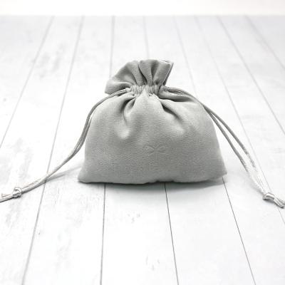 China Custom embossed gray envelope suede fabric pouch suede drawstring jewelry pouch logo suede pouches for sale