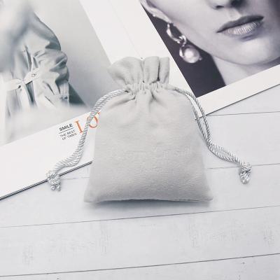 China Custom Envelope Faux Suede Pouch Jewelry Drawstring Embossed Suede Bead Pouch for sale