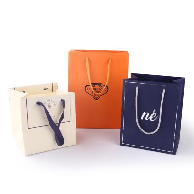 China Biodegradable Custom Paper Bags With Your Own Logo Christmas Shopping Gift Christmas Paper Suitcase for sale