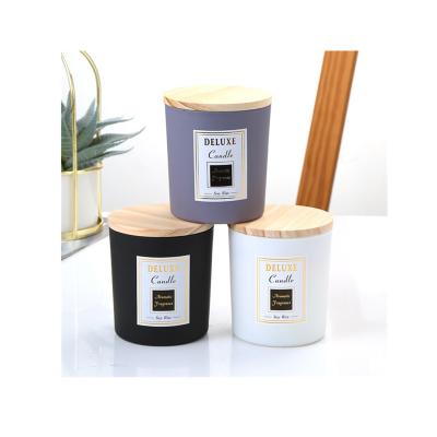 China Creative Multicolor Frosted Transparent Tube Candle Jars With Black Wooden Lids Candle Jars for sale