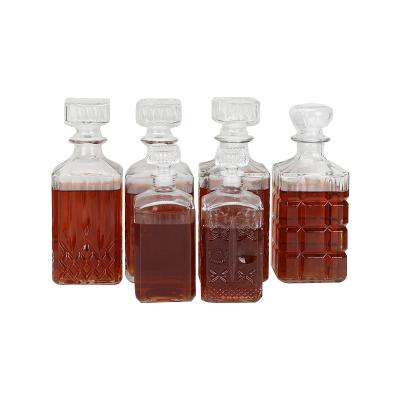 China Factory Supply Pharmaceutical Glass Wine Bottle Square Transparent Wine Bottle for sale