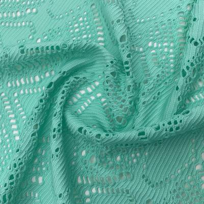 China Sustainable hot selling polyester spandex hollowed-out jacquard fabric for swimwear for sale