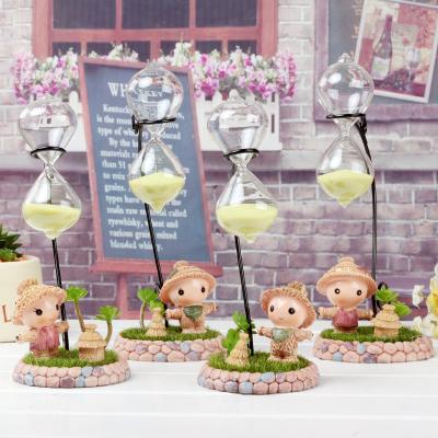 China Large Creative Table Top Plant Decoration Scarecrow Glass Hourglass for sale