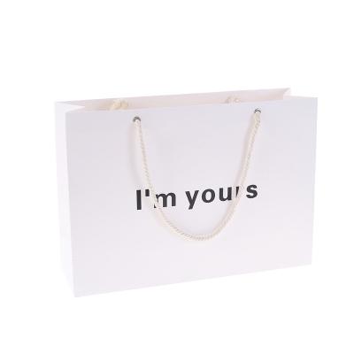 China Wholesale Customized Cheap Tote Bags New Product Recyclable Ivory Board Paper Free Design White Paper Bags Gift Shoes Apparel Bags for sale