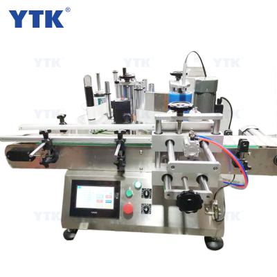 China Tabletop Automatic Food Round Bottle Sticker Placing Labeling Machine for Round Bottles for sale