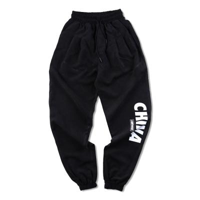 China Sweatpant Mens Autumn New High Waist Solid Casual Loose Cargo Pants Loose Elastic Streetwear Harem Pants for sale