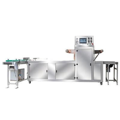 China Automatic Continuous Sealing And Food Packing Machine Lunch Box Catering Vacuum Sealer Machinery Line for sale