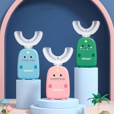 China Newborn Infant Baby Boy Girl Dinosaur Baby Silicone Toothbrush Clean Safety Soft U Shaped Milk Teeth Cleaning Brush 2-6T for sale