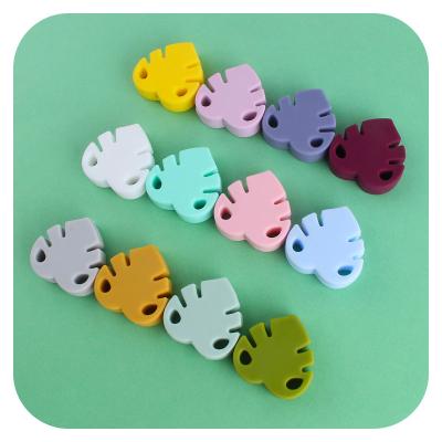 China Newest 2021 Newest Soft Silicone Pearl Food Grade Soft Silicone Chewing Banana Leaf Cute Baby Teether for sale