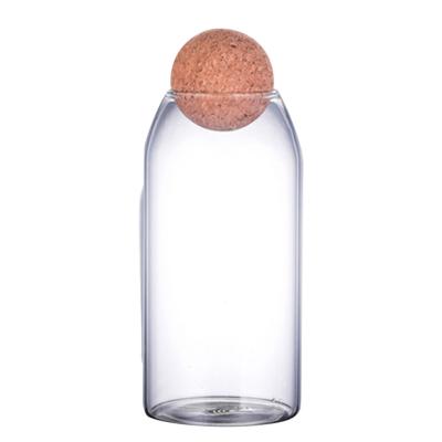 China Hot Selling Handmade Borosilicate Glass Canister Food Storage Heatable Jars With Wooden Lid Cork Ball Stopper for sale