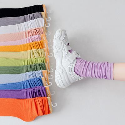 China Wholesale sporty 2021 spring and simple college style girl candy color new solid color summer pile socks female personality literar for sale