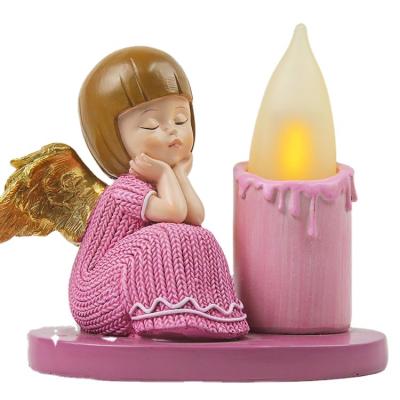 China Minimalist Polyresin Golden Miniature Wings Resting Fairy Angel Figure Elf Statue With LED Candle For Home Decoration for sale