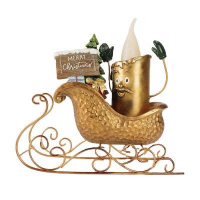 China Europe Christmas High Quality Resin Santa Sleigh With LED Golden Pillar Candle For Desktop Decoration for sale