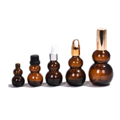 China New Design 10ml 30ml 50ml 100ml Gourd Shape Glass Amber Bottle Skin Care/Essential Oil Dispenser Empty Perfume Bottles With Dropper for sale