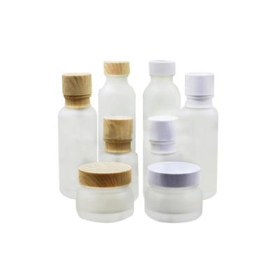 China Skincare 50g 50ml 120ml 150ml frosted empty glass jar cream sprayer with bamboo pattern lid cap /lotion pump plastic packaging bottle for sale