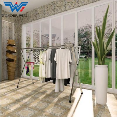 China Eco-friendly Double Pole X Shaped Telescopic Folding Hanging Clothes Rack Balcony Folding Clothes Drying Rack for sale