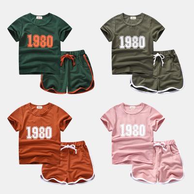 China Wholesale Polyester/Cotton Summer Children Kids Clothes Short Sleeve Sports Suit Girls Boys Summer T-Shirt And Shorts 2pcs Set for sale