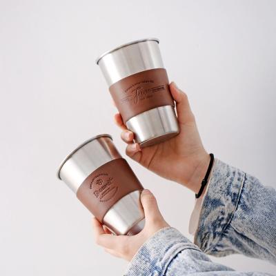 China Nordic Creative Juice Cup 304 Cups Sustainable Wind Stainless Steel Heat Insulation Water Cup Leather Anti-scalding Food Grade for sale