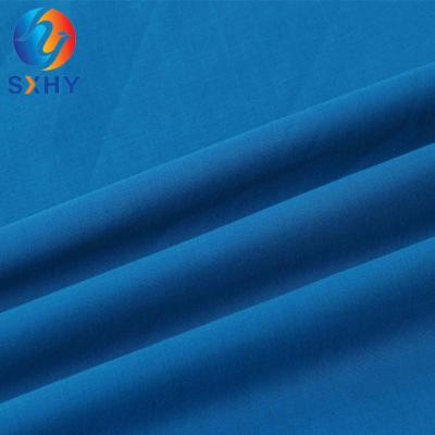 Cina Waterproof Polyester Cotton TC 65/35 45*45 133*94 Poplin Plain Dyed Women Dress Fabric For Shirt in vendita