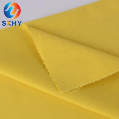 Cina TC 45*45 110*76 65/35 TC poplin polyester cotton waterproof single dyed raincoat fabric for beach shorts in vendita