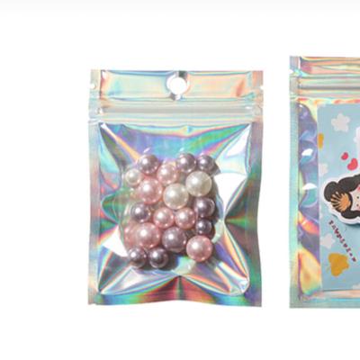 China Recyclable Recyclable Resealable Bright Outer Zipper Lock Silver Laser Zipper Aluminum Foil Mylar Rainbow Color Plastic Bags for sale