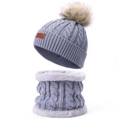 China Add Wool Designer Hot Sale Best Quality Knit Beanie Hat Winter Wool Beanie Merino Ball Knitted Hat Knitted Twist Cap With Custom Logo for sale