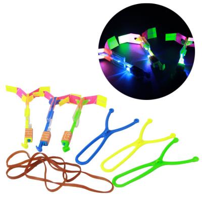 China Outdoor Luminous Ejection Helicopter LED Light Up Slingshot Ejection Lighting Flight Toy for Kids and Adults for sale