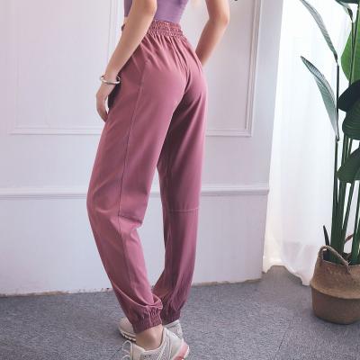 China Anti-Wrinkle High Waist Workout Clothes Peach Hips Loose Casual Women Sports Pants Casual for sale