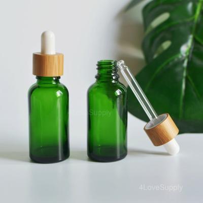 China Empty Perfume 50ml Glass Bottle Essential Oil Dropper Cosmetic Bamboo Cap Lid Cosmetic Glass Bottle With Mist Sprayer for sale