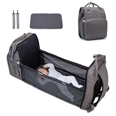 China Backpack Customized Waterproof Travel Diaper Bag Backpack With Foldable Baby Bed for sale