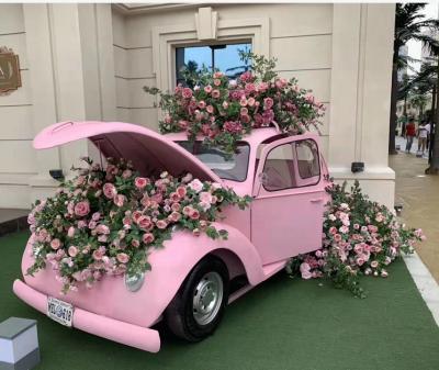 China Luckygoods Handmade New Arrival Aesthetic Pink Car with Artificial Flower Arrangement for Wedding Party Decoration for sale