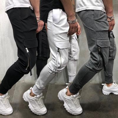 China Anti-wrinkle men's solid color multi-pocket hip-hop feet pants with rope sports pants thin casual pants for sale