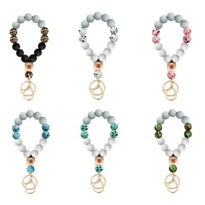 China 2021 Promotion Souvenir Gifts Wholesale Unique Unique Elegant Beaded Bracelet Silicone Key Chain Key Chain Ring Bracelets Wood Bead for sale