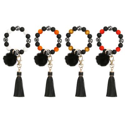 China Beaded Key Chain Bracelets Silicone Bead Wristband Bracelet Ring Leather Tassel Halloween Skull Key Bracelet Men Women Promotion Souvenir Gifts for sale