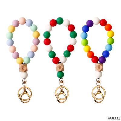 China Souvenir Gifts Promotion Hot Sale Christmas Rainbow Silicone Beaded Wrist Bracelet Keychain For Women Men for sale