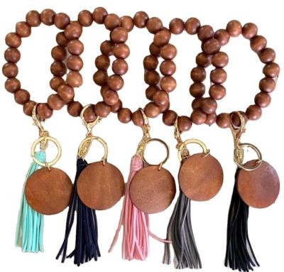 China Hot Selling Main Chain Bracelet Bohemia Monogram Macrame Bracelet Women Men Promotion Souvenir Gifts Wooden Bead Disc With Tassels for sale