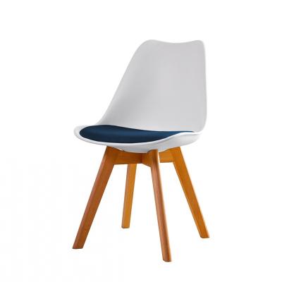 China Cooling Contemporary Nordic Modern Wooden Legs Dining Chairs Plastic White for sale